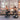 Friends doing a squat on a bosu ball